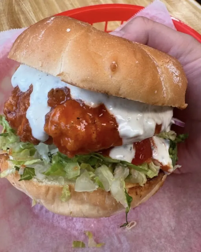 A hand-breaded fried fish sandwich with lettuce and house sauce at The Fisherman's Daughter in Hoonah, Alaska