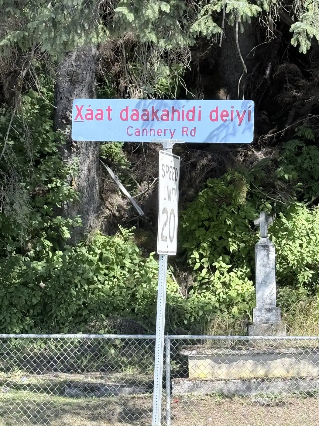 The Cannery Road sign in Tlingit and English near the historic cemetery